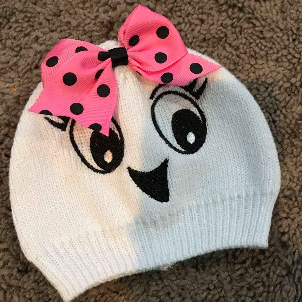Baby girl ghost hat with pink bow.